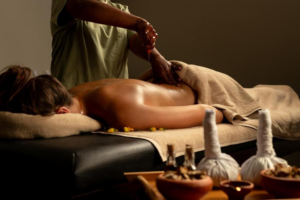 Guest enjoying an Ayurvedic oil treatment at Ayugiri wellness resort