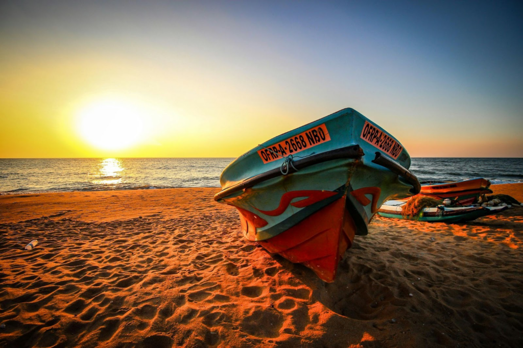 A Boat by the Negombo beach during sunset