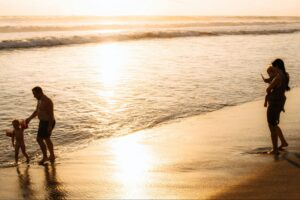 Family enjoying calm shoreline at Pasikuda Beach, a safe swimming beach on Sri Lanka’s east coast