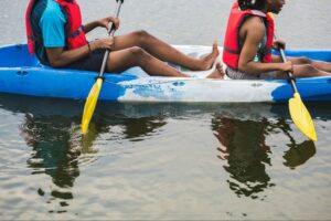 Close view of kayaking in Sri Lanka lagoon with paddlers exploring calm waters