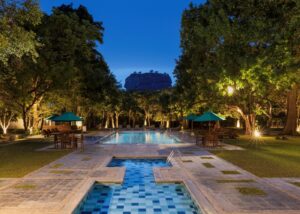 Property view at Hotel Sigiriya with Sigiriya Rock view, surrounded by trees in Sri Lanka
