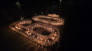 The Earth Hour logo made with oil lamps and plastic bottles