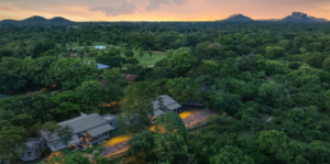 Aerial view of Ayugiri Ayurveda Wellness Resort with Sigiriya Rock in the distance.
