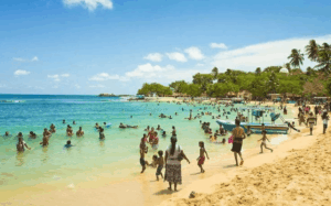 Beachgoers enjoying Bentota's peak season, December to February.