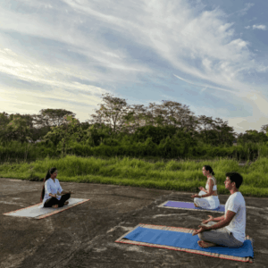 Couple taking part in guided meditation in nature at Ayugiri.