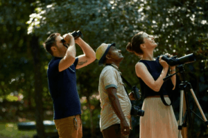 Guests with binoculars on a naturalist-led trail near Hotel Sigiriya. 